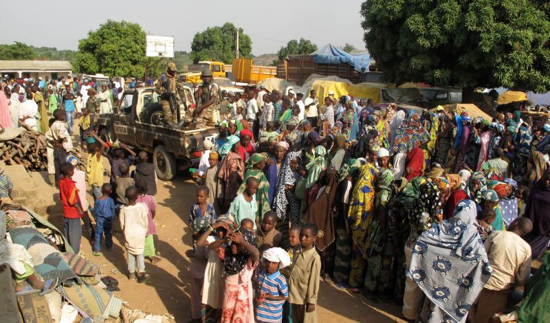 Muslim women line up at a Red Cross distribution outside the mosque in Bouar. United Nations peacekeepers guard the mosque, where thousands of Muslim residents gather each evening for safety. Muslim women line up at a Red Cross distribution outside the mosque in Bouar. United Nations peacekeepers guard the mosque, where thousands of Muslim residents gather each evening for safety.