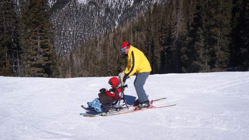 Tilghman Logan and his instructor, Craig Stagg, do some practice turns using sit skis. Some ski resorts have created opportunities for people with disabilities to participate in snow sports. Tilghman Logan and his instructor, Craig Stagg, do some practice turns using sit skis. Some ski resorts have created opportunities for people with disabilities to participate in snow sports.