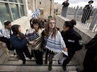 Rabbi Susan Silverman (center, left), the sister of American comedian Sarah Silverman, along with her teenage daughter Hallel Abramowitz (center, right), are arrested by Israeli police as they leave the Western Wall in Jerusalem, on Monday. Rabbi Susan Silverman (center, left), the sister of American comedian Sarah Silverman, along with her teenage daughter Hallel Abramowitz (center, right), are arrested by Israeli police as they leave the Western Wall in Jerusalem, on Monday.