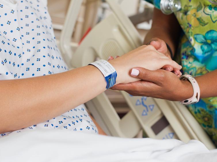 Nurse comforting patient in hospital Nurse comforting patient in hospital