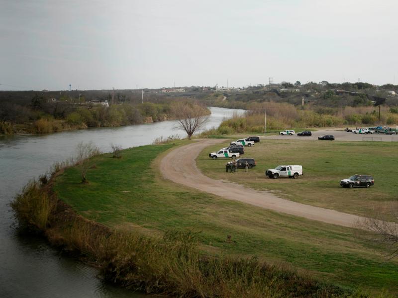 U.S. Border Patrol cars are seen from the bridge connecting Eagle Pass, Texas, with Piedras Negras, Mexico, near the banks of the Rio Grande in February. U.S. Border Patrol cars are seen from the bridge connecting Eagle Pass, Texas, with Piedras Negras, Mexico, near the banks of the Rio Grande in February.