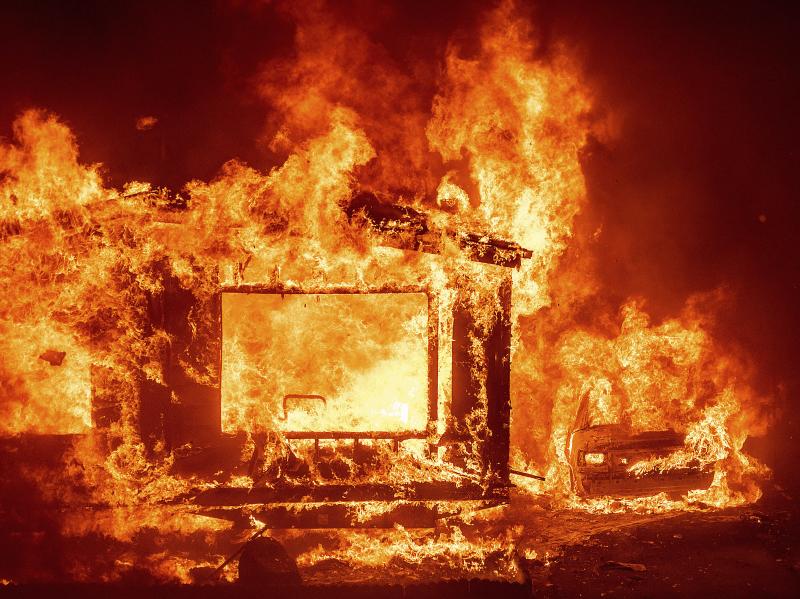 A mobile home and car burn at Spanish Flat Mobile Villa as the LNU Lightning Complex fires tear through unincorporated Napa County, Calif., on Tuesday. A mobile home and car burn at Spanish Flat Mobile Villa as the LNU Lightning Complex fires tear through unincorporated Napa County, Calif., on Tuesday.