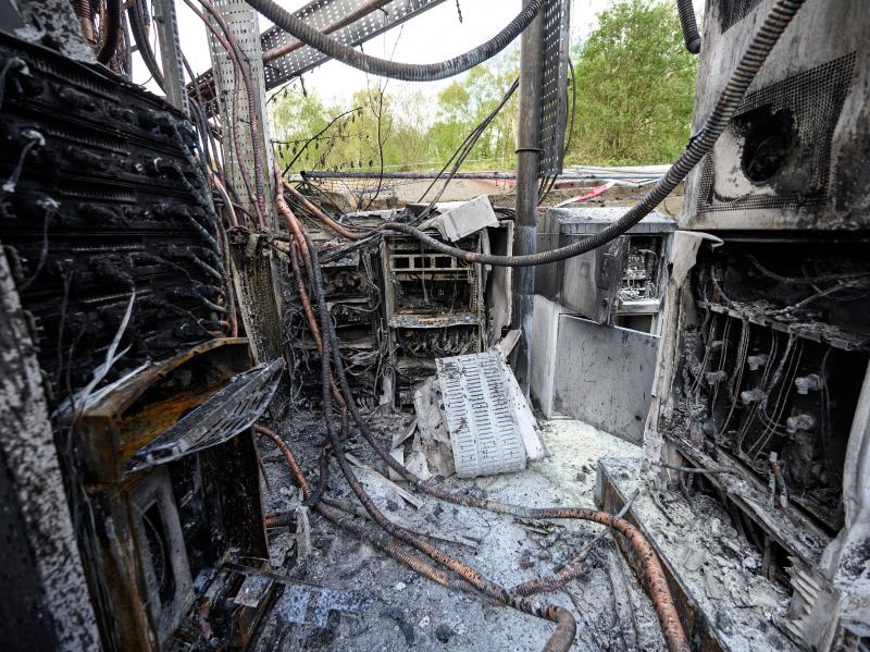 Cabling and telecommunications equipment is damaged after a fire in April in Huddersfield, England. The fire came as other cellphone towers burned amid conspiracy theories linking 5G mobile technologies to the coronavirus. Cabling and telecommunications equipment is damaged after a fire in April in Huddersfield, England. The fire came as other cellphone towers burned amid conspiracy theories linking 5G mobile technologies to the coronavirus.