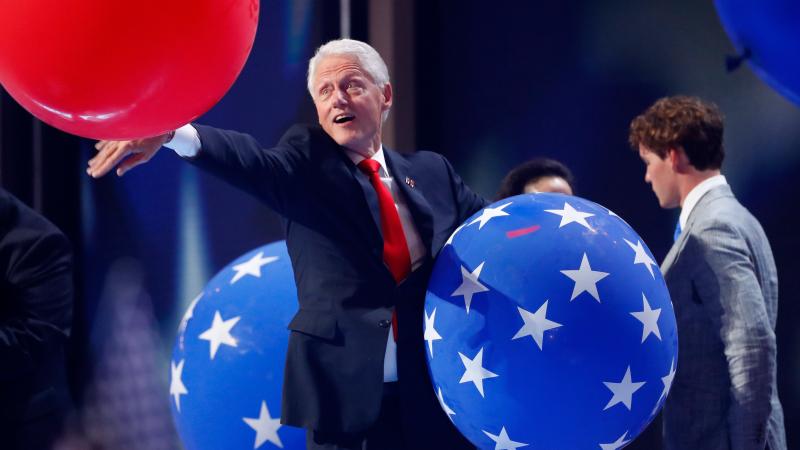 Former President Bill Clinton plays with balloons onstage at the end of the fourth day of the Democratic National Convention at the Wells Fargo Center in Philadelphia in July. Former President Bill Clinton plays with balloons onstage at the end of the fourth day of the Democratic National Convention at the Wells Fargo Center in Philadelphia in July.