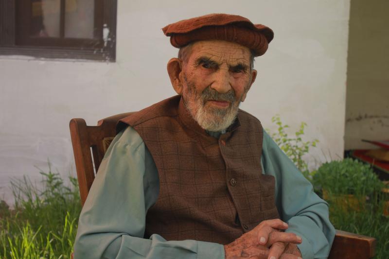 Aziz Abdul Alim, a 103-year-old man from a remote valley in Upper Chitral of northern Pakistan, is both a COVID survivor and a proud supporter of the COVID vaccine. Aziz Abdul Alim, a 103-year-old man from a remote valley in Upper Chitral of northern Pakistan, is both a COVID survivor and a proud supporter of the COVID vaccine.
