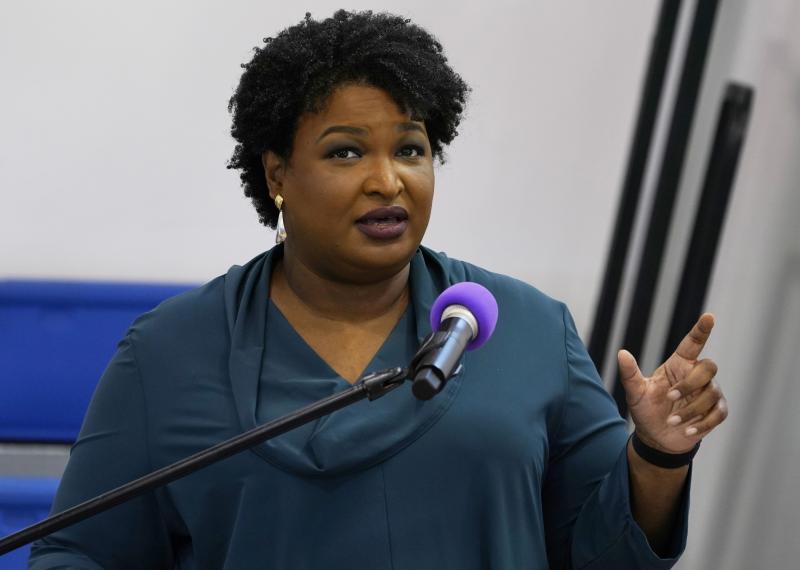 Stacey Abrams speaks during a church service in Norfolk, Va., on Oct. 17. A political organization led by the Democrat is branching out into paying off medical debts. Fair Fight Action said it's donating $1.34 million from its political action committee t Stacey Abrams speaks during a church service in Norfolk, Va., on Oct. 17. A political organization led by the Democrat is branching out into paying off medical debts. Fair Fight Action said it's donating $1.34 million from its political action committee t