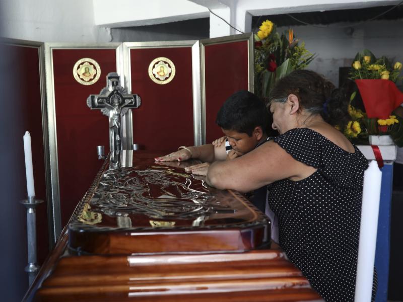 Twelve-year-old Jesús Ruiz grieves as he stands before the coffin containing the remains of his father, Mexican journalist Jorge Celestino Ruiz Vazquez, in Actopan, Veracruz, on Aug. 3. The Committee to Protect Journalists said Ruiz Vazquez was the third Twelve-year-old Jesús Ruiz grieves as he stands before the coffin containing the remains of his father, Mexican journalist Jorge Celestino Ruiz Vazquez, in Actopan, Veracruz, on Aug. 3. The Committee to Protect Journalists said Ruiz Vazquez was the third