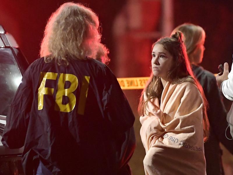 An FBI agent talks to a potential witness to the shooting at the Borderline Bar and Grill in Thousand Oaks, Calif., where a gunman opened fire inside the country dance bar on "college night." An FBI agent talks to a potential witness to the shooting at the Borderline Bar and Grill in Thousand Oaks, Calif., where a gunman opened fire inside the country dance bar on "college night."