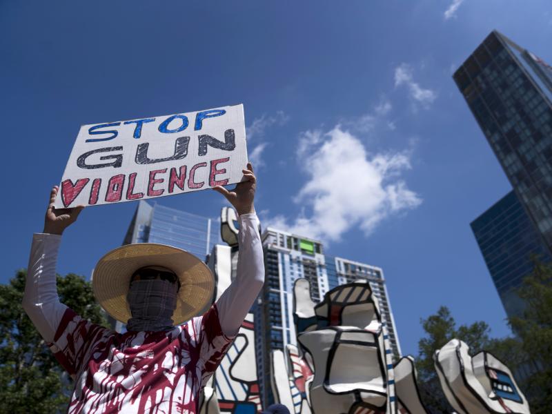 Gun control advocates hold signs during a protest at Discovery Green across from the National Rifle Association Annual Meeting at the George R. Brown Convention Center on Friday in Houston, Texas. Gun control advocates hold signs during a protest at Discovery Green across from the National Rifle Association Annual Meeting at the George R. Brown Convention Center on Friday in Houston, Texas.