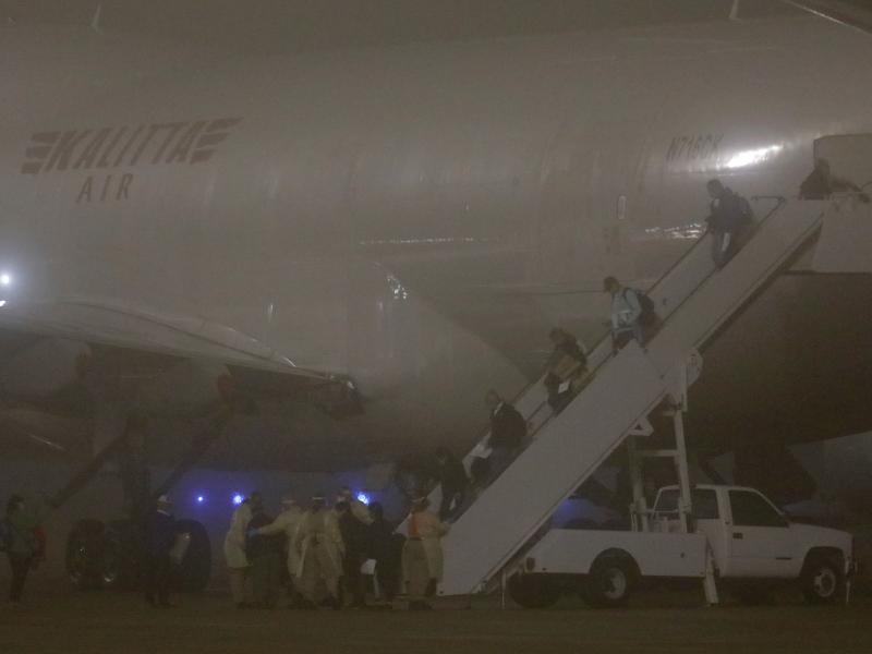 American evacuees from the Diamond Princess cruise ship arrive at Joint Base San Antonio-Lackland on Monday in San Antonio, Texas. American evacuees from the Diamond Princess cruise ship arrive at Joint Base San Antonio-Lackland on Monday in San Antonio, Texas.