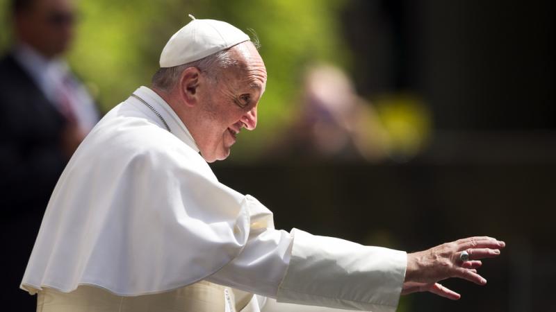 Pope Francis waves to schoolchildren after arriving at the Apostolic Nunciature, the Vatican's diplomatic mission in Washington, D.C., on Sept. 24. Pope Francis waves to schoolchildren after arriving at the Apostolic Nunciature, the Vatican's diplomatic mission in Washington, D.C., on Sept. 24.