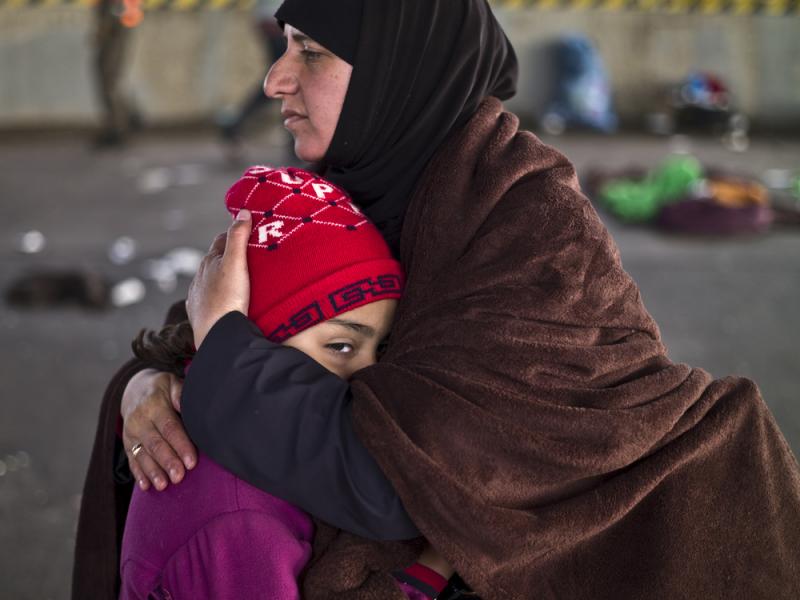 A Syrian refugee mother comforts her daughter after they spent the night in a parking lot on the Austrian side of the Hungarian-Austrian border. More than 4 million Syrians have fled the civil war in their devastated homeland, and such crises can take dec A Syrian refugee mother comforts her daughter after they spent the night in a parking lot on the Austrian side of the Hungarian-Austrian border. More than 4 million Syrians have fled the civil war in their devastated homeland, and such crises can take dec