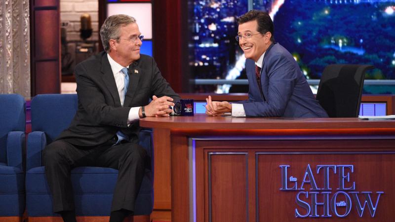 Stephen Colbert (right) talks with Republican presidential candidate Jeb Bush during Colbert's debut as Late Show host in New York. Stephen Colbert (right) talks with Republican presidential candidate Jeb Bush during Colbert's debut as Late Show host in New York.