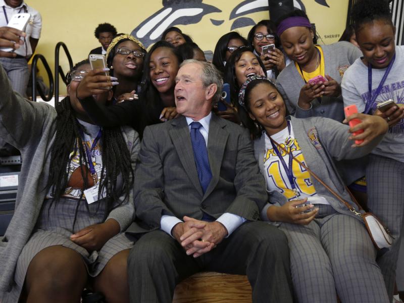 Former President George W. Bush poses for photos with students at Warren Easton Charter High School in New Orleans on Friday. He was visiting the city for the 10th anniversary of Hurricane Katrina. Former President George W. Bush poses for photos with students at Warren Easton Charter High School in New Orleans on Friday. He was visiting the city for the 10th anniversary of Hurricane Katrina.