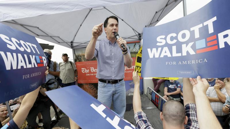 Republican presidential candidate and Wisconsin Gov. Scott Walker speaks at the Iowa State Fair, where he encountered protesters over his record in Wisconsin. Republican presidential candidate and Wisconsin Gov. Scott Walker speaks at the Iowa State Fair, where he encountered protesters over his record in Wisconsin.