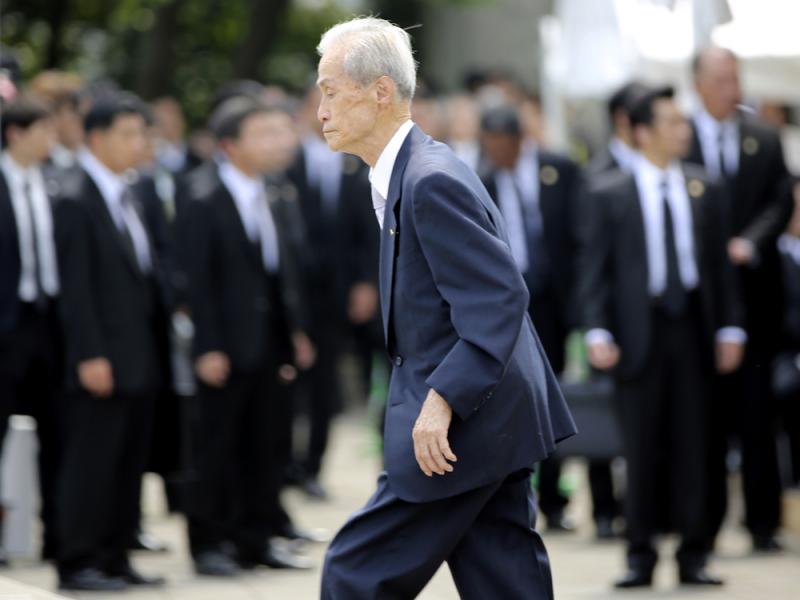 Sumiteru Taniguchi, 86, a survivor of the 1945 atomic bombing of Nagasaki, walks up to deliver his speech at the 70th anniversary of the atomic bombing in Nagasaki, southern Japan, on Sunday. Sumiteru Taniguchi, 86, a survivor of the 1945 atomic bombing of Nagasaki, walks up to deliver his speech at the 70th anniversary of the atomic bombing in Nagasaki, southern Japan, on Sunday.