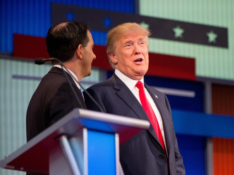 Republican presidential candidates Donald Trump (right) and Wisconsin Gov. Scott Walker speak together during a commercial break at the first Republican presidential debate in Cleveland on Thursday. Trump's remarks about Fox News debate moderator Megyn Ke Republican presidential candidates Donald Trump (right) and Wisconsin Gov. Scott Walker speak together during a commercial break at the first Republican presidential debate in Cleveland on Thursday. Trump's remarks about Fox News debate moderator Megyn Ke