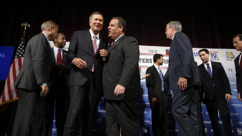 Republican presidential candidates, from left, Lindsey Graham, Ben Carson, John Kasich, Chris Christie, Bobby Jindal, Jeb Bush, Scott Walker and Rick Santorum speak among themselves after a forum Monday, Aug. 3, 2015, in Manchester, N.H. Republican presidential candidates, from left, Lindsey Graham, Ben Carson, John Kasich, Chris Christie, Bobby Jindal, Jeb Bush, Scott Walker and Rick Santorum speak among themselves after a forum Monday, Aug. 3, 2015, in Manchester, N.H.