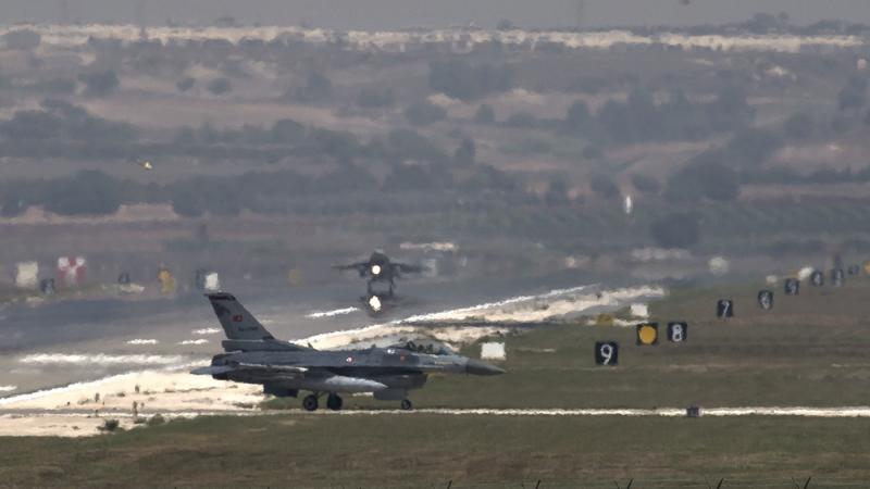 A U.S. Air Force plane takes off as a Turkish air force fighter jet taxis at the Incirlik airbase, southern Turkey, in 2013. Reversing an earlier policy, Ankara has agreed to allow the U.S.-led coalition to fly anti-ISIS airstrikes from the base. A U.S. Air Force plane takes off as a Turkish air force fighter jet taxis at the Incirlik airbase, southern Turkey, in 2013. Reversing an earlier policy, Ankara has agreed to allow the U.S.-led coalition to fly anti-ISIS airstrikes from the base.