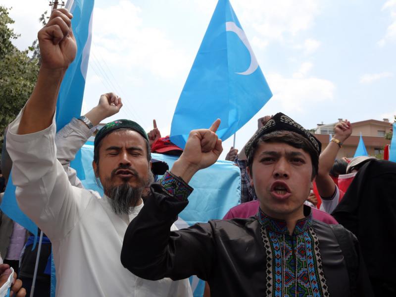 A group of Uighur protesters demonstrate outside the Thai embassy in Ankara, Turkey, on Thursday to protest Thailand's deportation of 100 Uighur refugees back to China. A group of Uighur protesters demonstrate outside the Thai embassy in Ankara, Turkey, on Thursday to protest Thailand's deportation of 100 Uighur refugees back to China.