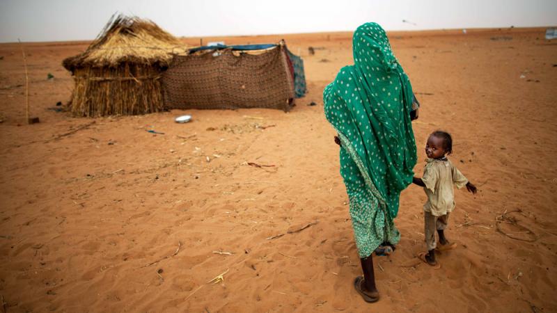 A woman and her daughter walk at the Zam Zam camp for internally displaced people in North Darfur, Sudan, in June 2014. The U.S. and other countries have said that Sudan is committing genocide in Darfur, and the United Nations has an ongoing peacekeeping A woman and her daughter walk at the Zam Zam camp for internally displaced people in North Darfur, Sudan, in June 2014. The U.S. and other countries have said that Sudan is committing genocide in Darfur, and the United Nations has an ongoing peacekeeping