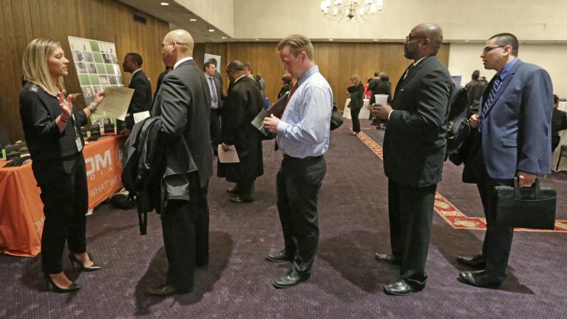 Bianca Medici (left), a corporate recruiter for CDM Media, speaks with job applicants during a Chicago job fair in May. The economy added 223,000 jobs in June, and unemployment fell to its lowest rate since 2008. Bianca Medici (left), a corporate recruiter for CDM Media, speaks with job applicants during a Chicago job fair in May. The economy added 223,000 jobs in June, and unemployment fell to its lowest rate since 2008.