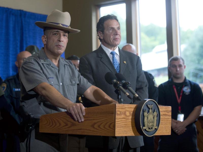 New York State Police Superintendent Joseph D'Amico (left) speaks during a news conference Sunday evening as Gov. Andrew Cuomo looks on. At the press conference, both men detailed the capture of fugitive David Sweat earlier that day in Malone, N.Y. New York State Police Superintendent Joseph D'Amico (left) speaks during a news conference Sunday evening as Gov. Andrew Cuomo looks on. At the press conference, both men detailed the capture of fugitive David Sweat earlier that day in Malone, N.Y.