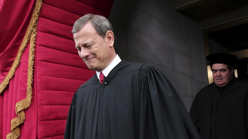 U.S. Supreme Court Chief Justice John Roberts, followed by Justice Antonin Scalia, at the U.S. Capitol in Washington, D.C., in 2013 U.S. Supreme Court Chief Justice John Roberts, followed by Justice Antonin Scalia, at the U.S. Capitol in Washington, D.C., in 2013