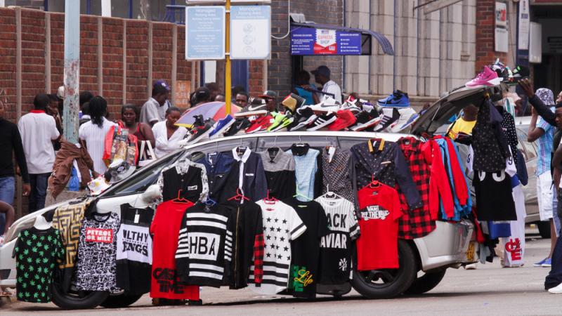 Street hawkers have taken over so many sidewalks in Harare's city center that some vendors are turning their cars into makeshift shops. Street hawkers have taken over so many sidewalks in Harare's city center that some vendors are turning their cars into makeshift shops.