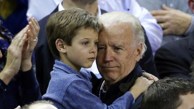 Vice President Joe Biden holds Beau Biden's son Hunter during a basketball game in 2013. Vice President Joe Biden holds Beau Biden's son Hunter during a basketball game in 2013.