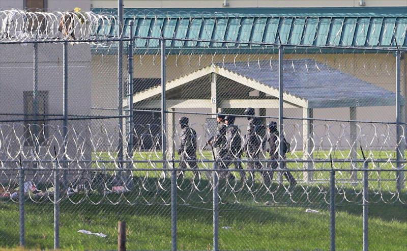 Armed personnel patrol the grounds of the Tecumseh State Correctional Institution, in Tecumseh, Neb., on Monday. Armed personnel patrol the grounds of the Tecumseh State Correctional Institution, in Tecumseh, Neb., on Monday.