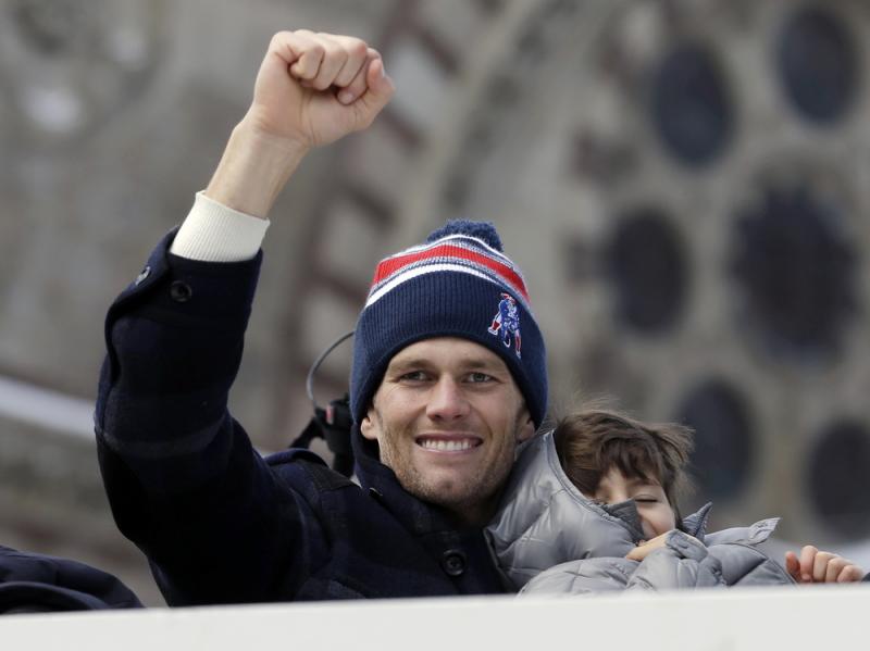 New England Patriots quarterback Tom Brady waves during a parade in Boston in February. Brady is among those singled out in a new report on New England Patriots quarterback Tom Brady waves during a parade in Boston in February. Brady is among those singled out in a new report on