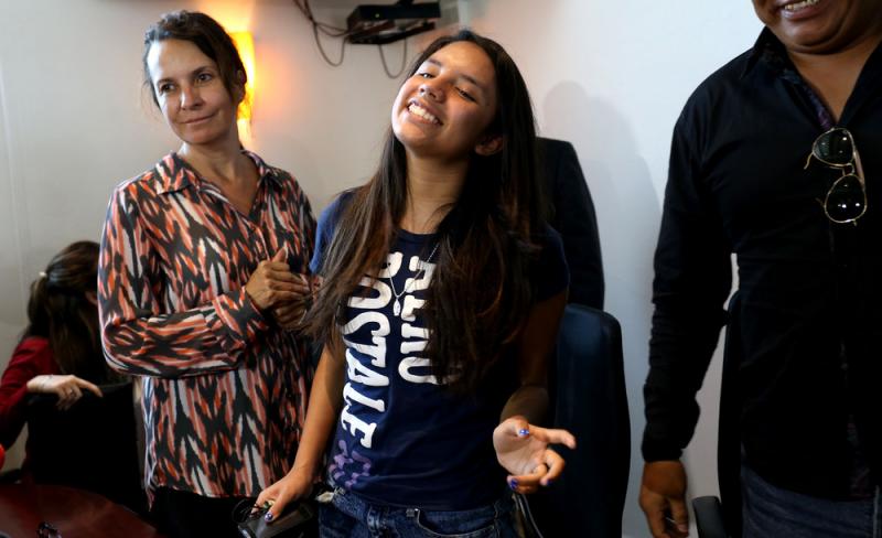 Alondra Luna Nunez, 14, smiles at a news conference upon her arrival at the Guanajuato International Airport in Silao, Mexico, on Wednesday. The Mexican girl, who was taken from a courthouse by police and sent kicking and screaming to the U.S., returned h Alondra Luna Nunez, 14, smiles at a news conference upon her arrival at the Guanajuato International Airport in Silao, Mexico, on Wednesday. The Mexican girl, who was taken from a courthouse by police and sent kicking and screaming to the U.S., returned h