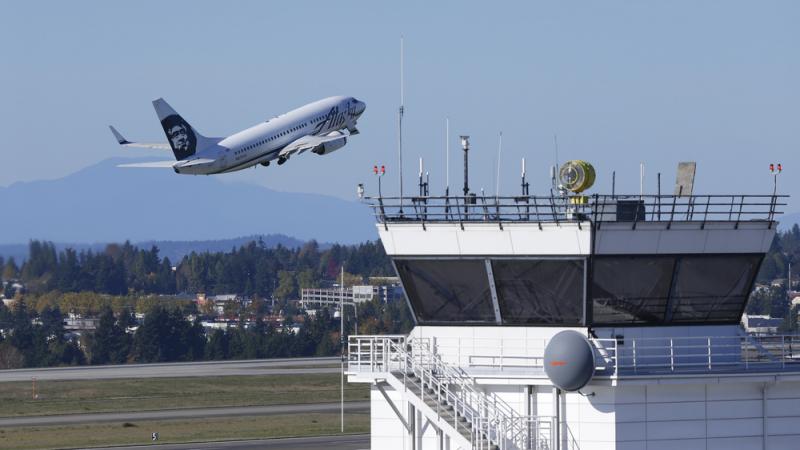 An air traffic control tower at Seattle-Tacoma International Airport. An air traffic control tower at Seattle-Tacoma International Airport.