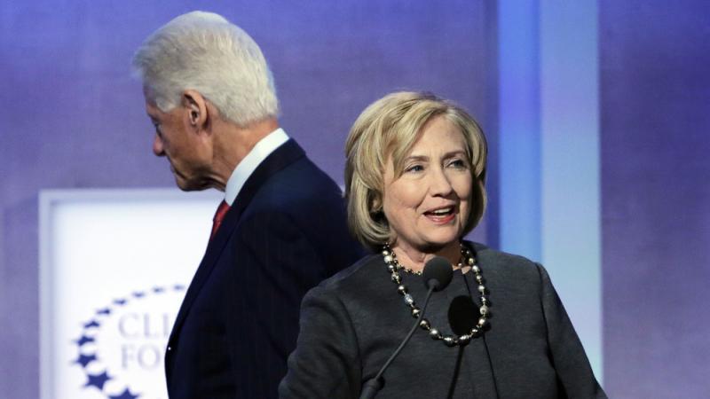 Hillary Clinton begins to speak as her husband, former President Bill Clinton, moves to take a seat after introducing her at the Clinton Global Initiative on Sept. 22, 2014, in New York. Hillary Clinton begins to speak as her husband, former President Bill Clinton, moves to take a seat after introducing her at the Clinton Global Initiative on Sept. 22, 2014, in New York.