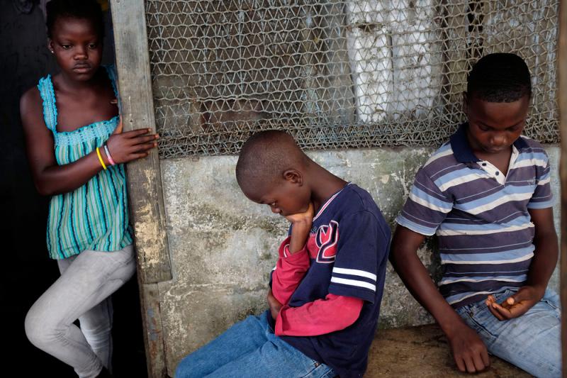 Promise Cooper, 16, Emmanuel Junior Cooper, 11, and Benson Cooper, 15, of Monrovia lost their mother, Princess, in July and their father, Emmanuel, in August. Promise Cooper, 16, Emmanuel Junior Cooper, 11, and Benson Cooper, 15, of Monrovia lost their mother, Princess, in July and their father, Emmanuel, in August.