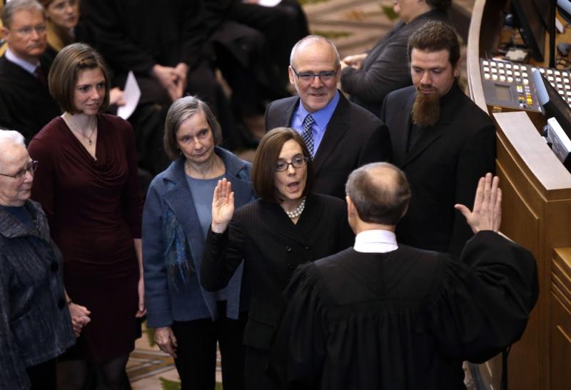 Oregon Secretary of State Kate Brown is sworn in as Oregon Governor by Oregon Chief Justice Thomas A. Balmer in Salem, Ore., on Wednesday. Oregon Secretary of State Kate Brown is sworn in as Oregon Governor by Oregon Chief Justice Thomas A. Balmer in Salem, Ore., on Wednesday.