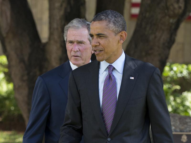 President Obama and former President George W. Bush in Dar Es Salaam, Tanzania, in 2013. President Obama and former President George W. Bush in Dar Es Salaam, Tanzania, in 2013.