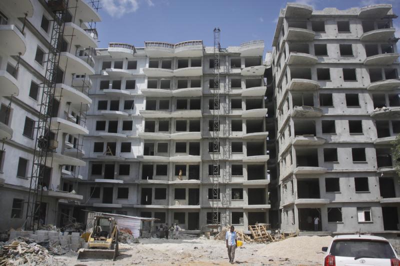 A Somali man walks in front of a high-rise apartment building under construction in Mogadishu on Nov. 4. Somalia, along with North Korea, is seen as the most-corrupt country in the world, according to the Corruption Perception Index released today by Tran A Somali man walks in front of a high-rise apartment building under construction in Mogadishu on Nov. 4. Somalia, along with North Korea, is seen as the most-corrupt country in the world, according to the Corruption Perception Index released today by Tran