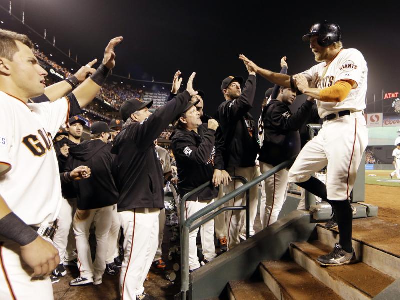 San Francisco Giants' Hunter Pence is congratulated in the dugout after scoring during the sixth inning of Game 4 of the World Series against the Kansas City Royals on Saturday. San Francisco Giants' Hunter Pence is congratulated in the dugout after scoring during the sixth inning of Game 4 of the World Series against the Kansas City Royals on Saturday.