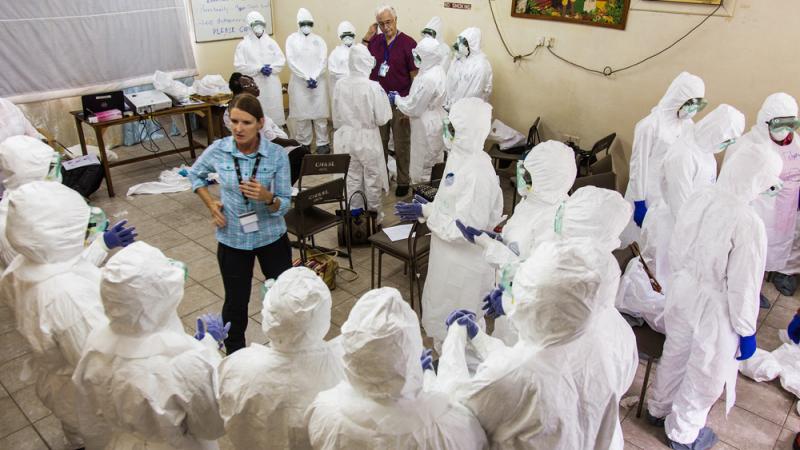 A World Health Organization worker trains nurses how to use Ebola protective gear in Freetown, Sierra Leone. A World Health Organization worker trains nurses how to use Ebola protective gear in Freetown, Sierra Leone.