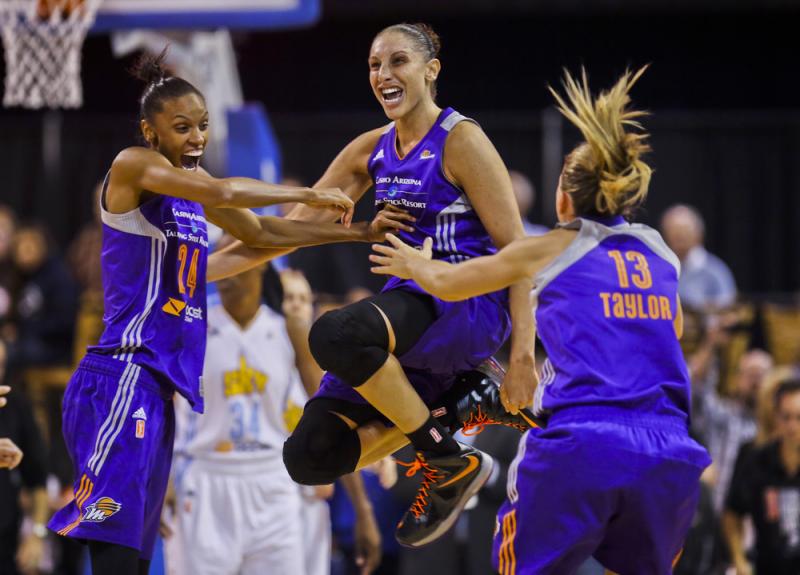 The Phoenix Mercury's Diana Taurasi celebrates the team's championship win Friday with DeWanna Bonner (24) and Penny Taylor (13), after beating the Chicago Sky in Game 3 of the WNBA Finals. The Phoenix Mercury's Diana Taurasi celebrates the team's championship win Friday with DeWanna Bonner (24) and Penny Taylor (13), after beating the Chicago Sky in Game 3 of the WNBA Finals.