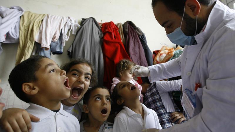 Syrian boys line up to get the polio vaccine at a refugee camp in Sidon, Lebanon, on Nov. 7. The Lebanese government plans to vaccinate all kids under age 5 for the virus, including Syrian refugees. Syrian boys line up to get the polio vaccine at a refugee camp in Sidon, Lebanon, on Nov. 7. The Lebanese government plans to vaccinate all kids under age 5 for the virus, including Syrian refugees.