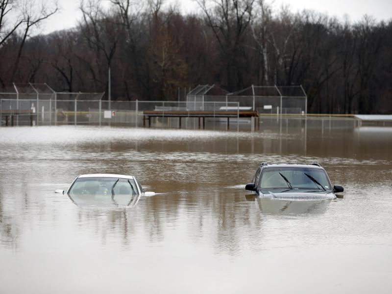 Two cars are submerged in floodwaters in a park in Kimmswick, Mo. Gov. Jay Nixon has declared a state of emergency because of widespread flooding around the state, which has closed many roads. Two cars are submerged in floodwaters in a park in Kimmswick, Mo. Gov. Jay Nixon has declared a state of emergency because of widespread flooding around the state, which has closed many roads.