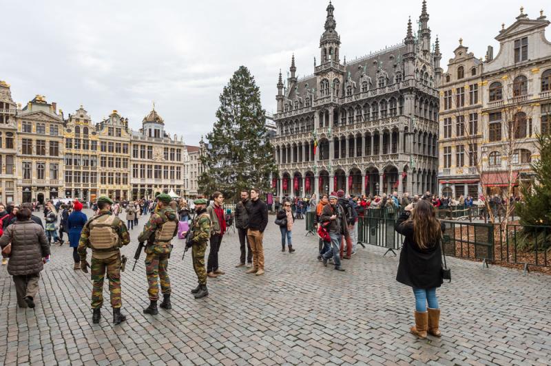 Soldiers patrol outside the Grand Place in Brussels on Tuesday. Police arrested two people on suspicion of planning attacks at tourist spots in the city over the holidays. Soldiers patrol outside the Grand Place in Brussels on Tuesday. Police arrested two people on suspicion of planning attacks at tourist spots in the city over the holidays.