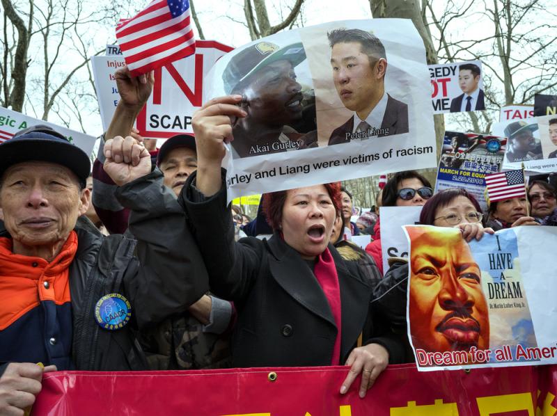 Protesters attend a rally in the Brooklyn borough of New York on Feb. 20 in support of a former NYPD Officer Peter Liang. Protesters attend a rally in the Brooklyn borough of New York on Feb. 20 in support of a former NYPD Officer Peter Liang.