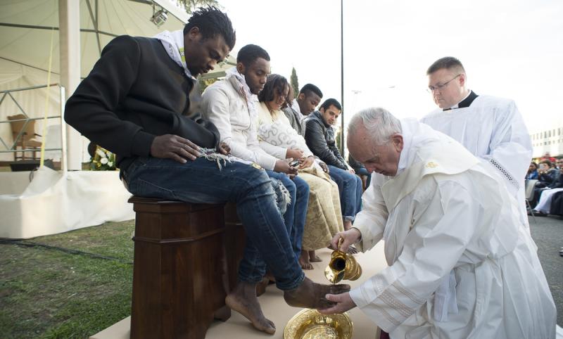 Pope Francis washes the foot of a refugee during a ritual at the Castelnuovo di Porto refugees center outside Rome on Thursday. Pope Francis washes the foot of a refugee during a ritual at the Castelnuovo di Porto refugees center outside Rome on Thursday.