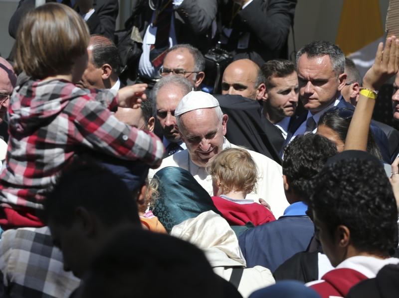 Pope Francis meets migrants at the Moria refugee camp on the Greek island of Lesbos on Saturday. Pope Francis meets migrants at the Moria refugee camp on the Greek island of Lesbos on Saturday.