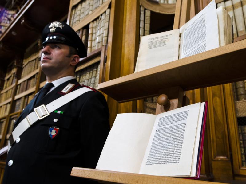 Two versions of a letter from Christopher Columbus about his discovery of the New World are displayed in Rome. The book on the bottom, produced centuries ago, has just been returned after having been stolen and replaced with a forgery (top). Two versions of a letter from Christopher Columbus about his discovery of the New World are displayed in Rome. The book on the bottom, produced centuries ago, has just been returned after having been stolen and replaced with a forgery (top).
