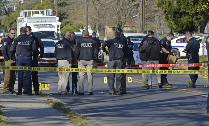 Officers investigate the scene of a shooting in Baton Rouge, La., in February. Officers investigate the scene of a shooting in Baton Rouge, La., in February.